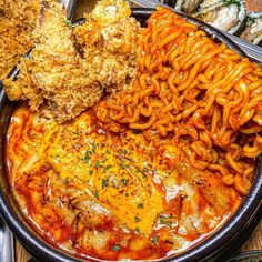 a bowl filled with noodles and other food items