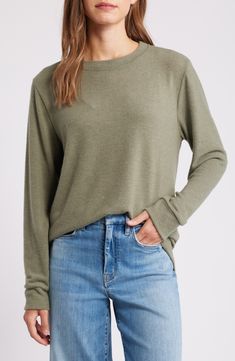 Cozy up for casual hangouts in this brushed jersey pullover that's destined to become a weekend-wardrobe favorite. 26 1/2" length Crewneck Long sleeves 78% polyester, 18% rayon, 4% spandex Machine wash, dry flat Imported Everyday Comfy Tops With Soft Texture, Comfy Everyday Tops With Soft Texture, Cozy Everyday Tops With Soft Texture, Cozy Tops With Soft Texture For Everyday, Cozy Soft Texture Tops For Everyday Wear, Comfortable Cozy Fit Soft Knit Top, Cozy Fit Soft Knit Comfortable Top, Comfortable Soft Knit Cozy Top, Comfortable Soft Knit Cozy Fit Top