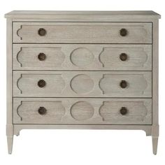 a white dresser with drawers and knobs on the bottom drawer, in front of a white background