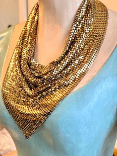 A stunning vintage Art Deco or Disco designer signed Whiting & Davis gold-tone mesh bib necklace.  Signed on the hang tag, the necklace weighs 132 grams.  It measures up to 19" wearable length, including the extender chain.  Depth (north to south)  of scarf-shape bib is 9".  Excellent vintage condition with no finish wear.  All mesh links are tightly connected. Glamorous Gold Necklace For Evening, Unique Gold Party Necklace, Unique Gold Necklace For Party, Unique Gold Jewelry For Evening, Vintage Gold Chain Necklace For Party, Vintage Gold Chain Necklace For Evening, Gold Costume Jewelry Bib Necklace, Gold Bib Necklace As A Gift, Gold Bib Necklace With Chain For Gift