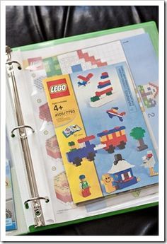 a binder with legos on it and some other things in the binder