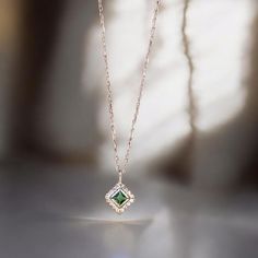 ✨COCOMIA ELITE EMERALD SQUARE PAVE NECKLACE✨  Width: 0.20 inches (5 mm) 📏 | Length: 0.20 inches (5 mm) 📏 | Height: 0.12 inches (3 mm) 📏  ⚖️Weight: 0.061 ounces (1.75 grams)  Discover Elegance: Elevate your style with our exquisite Emerald Square Pave Necklace. ✨ Featuring a high-quality Green Zircon Pendant 💎, this piece adds sophistication to any outfit. Perfect for everyday wear and special occasions 🎊. Casual Chic: Pair this elegant necklace with a simple blouse and jeans for a sophisticated, everyday look. The minimalist design ensures it complements various outfits without overpowering them.  Special Occasions: Perfect for weddings 💍, anniversaries 🎉, or any significant event, this necklace adds a touch of luxury and personal flair. The August birthstone makes it a memorable gi Rose Gold Square Pendant Necklace For Anniversary, Square Pendant Jewelry With Delicate Chain For Anniversary, Delicate Chain Jewelry With Square Pendant For Anniversary, Elegant Square Pendant Jewelry For Anniversary, Elegant Square Pendant Jewelry For Anniversary Gift, Green Clavicle Chain Necklace For Wedding, Square Dainty Jewelry Gift, Elegant Square Necklaces For Anniversary, Minimalist Rectangular Pendant Necklace For Wedding