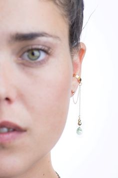 Gold ear cuff with clear green Swarovski crystal drop no | Etsy Unique Ear Cuffs, Ear Wraps, Crystal Ear Cuff, Ear Cuff Jewelry, Cuff Earring, Jewelry Swarovski, Wrap Earrings, Gold Ear Cuff, Cuff Jewelry