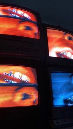 four televisions with different colored images on them