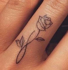 a small rose tattoo on the ring finger is one of the best tattoos for women