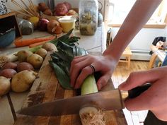 Chopping leeks for potato leak soup with chicken stock Soup With Chicken Stock, Potato Leak, Potato And Leak Soup, Soup With Chicken, Foods Recipes