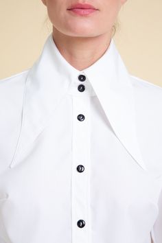 The White Spread Pointed Collar Cotton Blouse for women is a stylish and sophisticated garment that will give any outfit an upgrade. This elegant blouse features a unique collar design that adds a touch of modernity to its overall look. Designed & manufactured in our own studio. Product code: AoS-SHWM20-1-WTCO 98% Cotton, 2% Elastane Relaxed fit with dropped shoulders Spread pointed collar Button-up front Buttoned cuffs Machine wash Merle is 176 cm and is wearing a size S Our sizes are designed Cotton Blouse Design, Classic Blouse, Design Blouse, Blouse Cotton, Classic Blouses, Blouse Long Sleeve, Elegant Blouses, Blouse For Women, Collar Designs