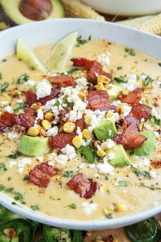 a white bowl filled with soup and topped with toppings