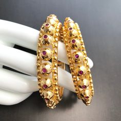 "2.6 Kundan Gokhru Kada/Bangles Pair of 2/Golden Ruby Gokhru bangles/Sabyasachi Bangles/Punjabi Bangles/Pakistani Jewelry/Kundan Bangles This bangles set is handcrafted with love and creativity and are perfect for any occasion may it be engagement, Wedding or any bridal ceremonies or social get-together. These handcrafted beautiful high quality are made in Copper with traditional Rajasthani Kundan, Polki and Meenakari handwork and are lined with fine lustrous stones. Pair them up with Indian tra Gold Jewelry For Eid Rituals, Bollywood Hand Set Bangle For Puja, Bollywood Style Bangle For Rituals With Intricate Design, Bollywood Style Hand Set Bangle For Puja, Navratri Chandbali Bangle With Tilla Details, Bollywood Style Bangle With Tilla For Rituals, Bollywood Style Bracelets With Intricate Design For Rituals, Bollywood Style Bracelets For Navratri Rituals, Bollywood Style Bracelets For Rituals With Intricate Design