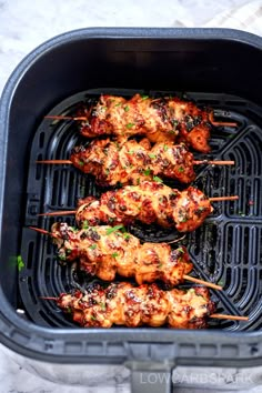 chicken skewers are being cooked on the grill