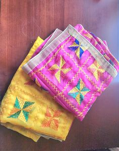 Phulkari dupattas available in hot pink or yellow. Handmade, exquisite craftsmanship. Lighwight material. Goes well with any plain outfit. Yellow Gota Work Dupatta For Puja, Yellow Chanderi Dupatta With Dori Work, Festival Multicolor Dupatta With Chikankari Embroidery, Pink Dupatta With Traditional Drape For Festival, Pink Traditional Drape Dupatta For Festival, Yellow Motif Dupatta For Navratri, Embroidered Yellow Dupatta For Navratri, Yellow Embroidered Dupatta For Navratri, Pink Festival Dupatta With Motifs