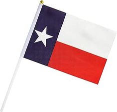 the texas state flag is flying in the wind