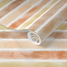 a wallpaper with watercolor stripes in shades of orange, yellow and pink on it