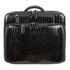 a black crocodile skin briefcase on a white background with clippings to the side