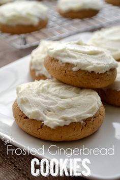 some cookies with white frosting are on a plate