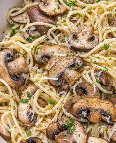 pasta with mushrooms and parsley in a pan