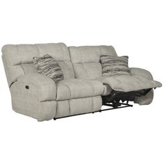 the reclining sofa has two pillows on it