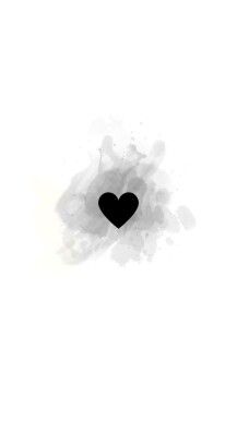 a black heart is in the middle of some white paint splattered on it