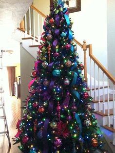 a christmas tree with purple and green ornaments