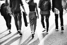 a group of young people walking down the street