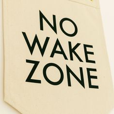 there is a no wake zone sign on the side of a bag that says'no wake zone '