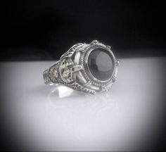 Our Version of the ring Johnny Depp wore in the movie Dark Shadows but we have made it in all sterling silver with a Black Onyx Stone set into the ring. Face of Ring is 20 mm wide by 18 mm high Set with a genuine Black Onyx Stone. Made in our studio by our own skilled silversmith artisans it has been oxidized to give it an antique look. We make to size so you need to provide us with your ring size in US or UK. Delivery is by DHL Express included in price. It takes around 10 to 14 days to make th Black Onyx Stone, Black Onyx Ring, Onyx Ring, Onyx Stone, Silver Man, Stone Settings, Signet Ring, Black Onyx, Onyx