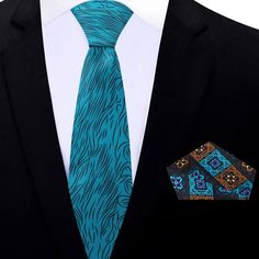 Eternal Green Abstract Tie This teal blue necktie with black wavy lines is a stunning accessory that is sure to make a statement. The bold, wavy pattern gives off a sense of movement and fluidity, adding a touch of energy and vibrancy to any outfit. The teal blue color is a refreshing departure from traditional necktie colors, making it a great option for those who want to stand out and make an impression. It pairs beautifully with a range of dress shirts, including white, light gray, and black. Charcoal Gray Suit, Yellow Bow Tie, Light Blue Dress Shirt, Purple Bow Tie, Blue Necktie, White Bow Tie, Plaid Bow Tie, Wavy Pattern, Pink Bow Tie