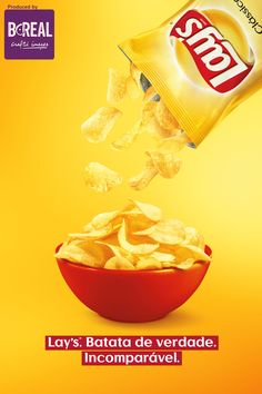 a red bowl filled with chips next to a yellow background