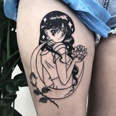 a girl with a flower tattoo on her thigh