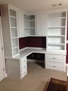 an empty room with white cabinets and carpeted flooring in the corner, along with a rug on the floor