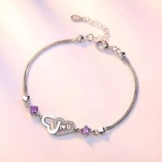 Hearts & Purple Gem Bracelet Sterling Silver Plated. Approximately 6.5”-8”Adjustable In Length When Laid Flat. All Items Are From A Smoke/Pet Free Home! Please Ask Any Questions Before Purchasing. Thank You For Looking! (Note- Due To Differences In Lighting/ Device Screens, Color May Vary Slightly From Photos). (Ss5-396) Cpd #Jennikait #Sterlingsilver #Heartjewelry #Bracelet Purple Gems, Purple Diamond, Estilo Boho Chic, Purple Bracelet, Gifts For Fiance, Simple Bracelets, Pendant Bracelet, 925 Jewelry, Wedding Bracelet