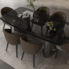 a glass table with four chairs around it