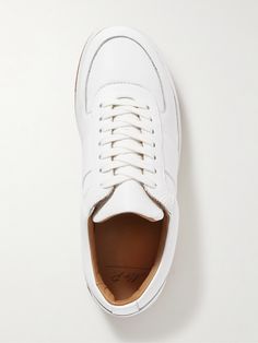 DESIGNED BY MR PORTER. As The Journal says, "Every man’s footwear rotation should contain a pair of white sneakers for one simple reason: they can be worn with absolutely anything". Mr P.'s 'Atticus' version is made from full-grain leather with tonal laces and lightweight rubber soles. Lower Impact Materials. This product is made using at least 50% lower-impact materials or ingredients. Find out more about our Consciously Crafted criteria here. White Leather Slip-on Sneakers For Sports, Classic White Low-top Golf Shoes, White Sports Sneakers With Stitched Sole, Sporty White Golf Shoes With Rubber Sole, White Sneakers With Stitched Sole And Round Toe, Casual White Sneakers With Stitched Sole, Classic White Custom Sneakers For Light Sports, Modern White Custom Sneakers, Plain Toe, Classic White Custom Sneakers With Abzorb Midsole