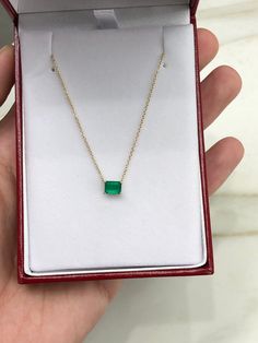 Featured here is a fine quality 0.80-carat stunning, East to West emerald necklace in fine 14K yellow gold. Displayed in the center is a vivacious green emerald with great clarity, accented by a simple four-prong gold mount, allowing for the emerald to be shown in full view. The earth mined, green emerald has a desirable lush green color with excellent qualities. An 18 inch is attached to the emerald pendant. This necklace is ideal for everyday use and is the perfect accessory to any outfit. Tot Emerald Cut Green Diamond Necklace Gift, Green Diamond-cut 14k Gold Necklace, 14k Gold Green Diamond Cut Necklace, Emerald Cut Yellow Gold Diamond Necklace Gift, Green Diamond Cut Necklace For Gift, Dainty Emerald Necklace For Formal Occasions, Emerald Cut Diamond Necklace As A Gift, 14k Gold Emerald Cut Emerald Necklace, Gold Emerald Cut Emerald Necklace Gift