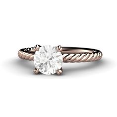 a rose gold engagement ring with a white diamond in the center and twisted band around it