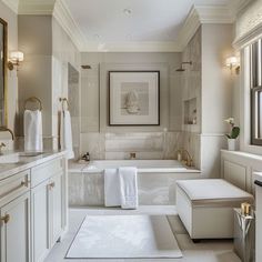 a large bathroom with white and gold fixtures