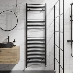 a bathroom with a sink, mirror and towel rack on the wall next to it