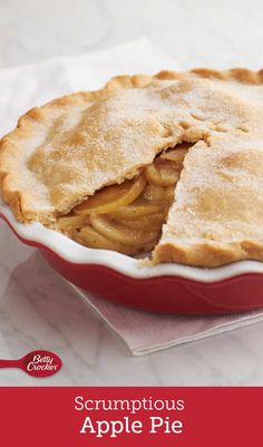 a close up of a pie on a table with the words scrumptious apple pie