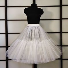 Super lush tulle petticoat. Petticoat made of semi-rigid tulle, which allows him to hold volume. The petticoat can be made in next colors. Сolors available to order: white, black, pink, hot pink, red, lavender, dark lavender, sky blue, electric blue, mint, burgundy, orange, yellow, green, peach. (look at the photo) Please write in personalization the color of the petticoat and belt you want. *The petticoat have 4 layers of semi-rigid tulle. *Thanks to the elastic belt, the skirt fits different s Tulle Petticoat With Attached Cancan, Fitted Tulle Petticoat Full Skirt, Fitted Full Skirt Tulle Petticoat, Full Tulle Petticoat With Crinoline, Fitted Tulle Petticoat Skirt, White Tulle Petticoat With Attached Cancan, Red Fitted Tulle Petticoat, White Crinoline Petticoat With Attached Cancan, Wedding Tiered Tulle Petticoat