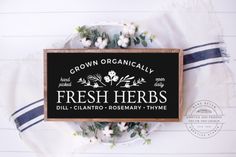 a sign that says, grown organicly fresh herbs dill - clanto rosemary thyme