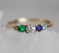 Cluster diamond, sapphire, emerald ring. Same design can be replicated with other gemstones per request. Item info: - main stone - 0.25ct diamond with GIA certificate, F to G color, VS clarity - 4mm diamond - side stones, top quality emerald and sapphire, peridot - emerald and blue sapphire 3mm - 14k/18k gold - please choose metal option and ring size from the drop down menu. ★ ★ ★ ★ ★ ★ ★ ★ ★ Enter my shop here: Click here to visit Capucinne shop: http://www.etsy.com/shop/capucinne Thanks for v Sapphire And Emerald Engagement Ring, Green Multi-stone Sapphire Diamond Ring, Fine Jewelry Green Sapphire Multi-stone Ring, Fine Jewelry Green Multi-stone Sapphire Ring, Fine Jewelry Multi-stone Emerald Diamond Ring, Blue Multi-stone Emerald Ring For Anniversary, Green Multi-stone Sapphire Promise Ring, Multi-stone Emerald Diamond Ring As Gift, Emerald Multi-stone Round Cut Ring