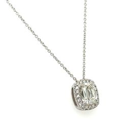 a necklace with an oval cut diamond in the center and small round diamonds around it