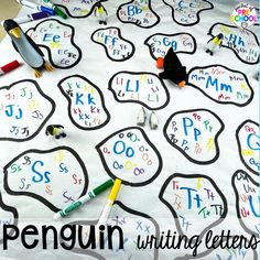 a table with writing letters on it, and some crayons laying on the paper