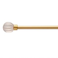 an image of a gold toilet roll with glass ball on the top and brass finish