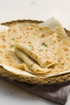 some tortillas are sitting on a plate