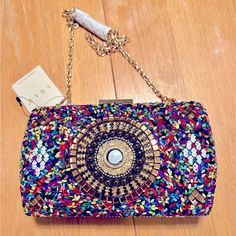 This Colorful Minaudiere Bag Has Gold Trim, Lots Of Color And Is A Perfect Accessory To Any Outfit. New With Tags. Multicolor Summer Clutch Evening Bag, Multicolor Clutch Evening Bag For Summer, Embellished Multicolor Evening Bag, Evening Multicolor Sequins Bag, Embellished Multicolor Shoulder Bag For Summer, Embellished Multicolor Summer Shoulder Bag, Embellished Multicolor Bags As Fashion Accessory, Multicolor Sequined Shoulder Bag For Party, Chic Multicolor Beaded Bags