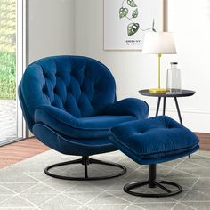 a blue chair and ottoman in a living room