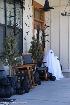 halloween decorations on the front porch of a house