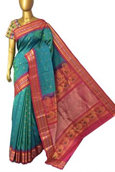 A pure enigmatic collection in golden color with the golden buti and silver zari border, with peacock motif on the pallu and meenakari butta work on spread across the saree in plaintive for, done in the traditional handloom style makes it a classic choice of many. Color: A shade of dual tone blue and green color Technique: Amazing work of golden zari buti work on the body with traditional weaving Fabric: Paithani Quality: Indyvogue's Assurance of Pure Silk Mark Certified Saree Festive Art Silk Saree With Peacock Design, Diwali Art Silk Saree With Peacock Design, Festive Peacock Design Art Silk Saree, Ceremonial Green Saree With Pallu, Diwali Chanderi Traditional Wear With Peacock Design, Bollywood Style Festive Saree With Peacock Design, Bollywood Style Saree With Peacock Design For Festive Occasions, Traditional Wear With Meenakari For Ceremonial Occasions, Ceremonial Traditional Wear With Pallu Details