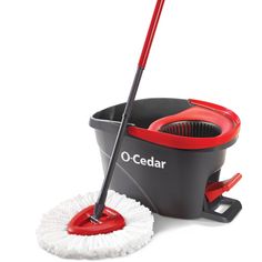 the o - cedar mop and bucket are set up to be used as a cleaning tool